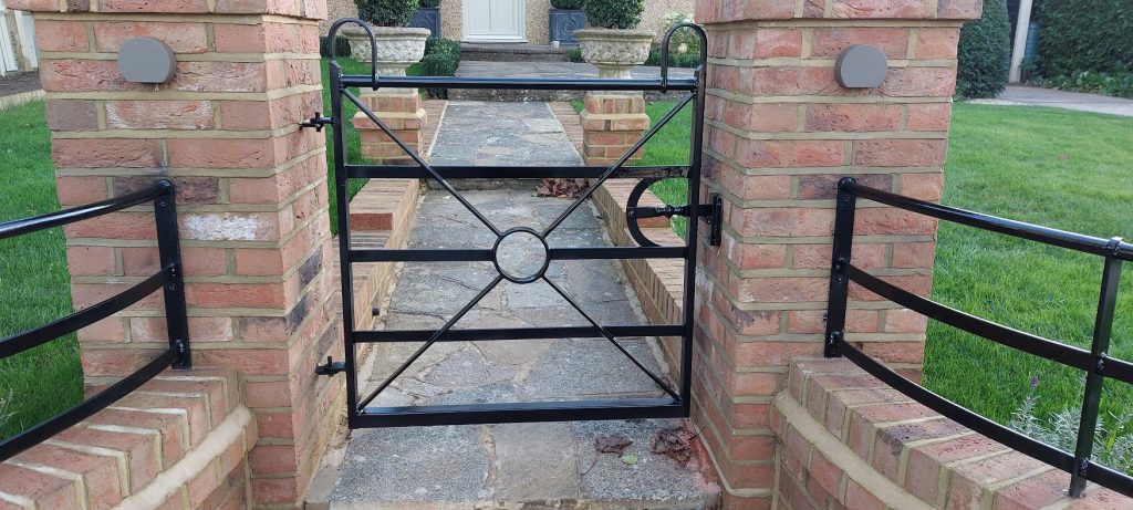 wrought iron gate, with matching railings.