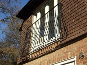 Juliet balcony railing on a tile hung house