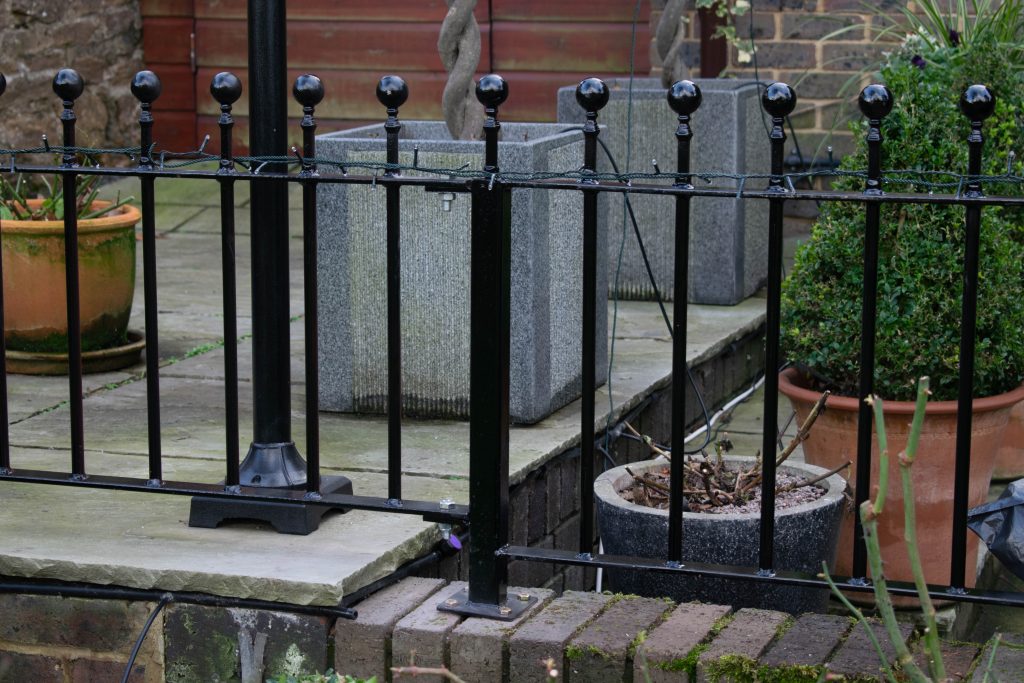 Wrought iron railing, with step up.
