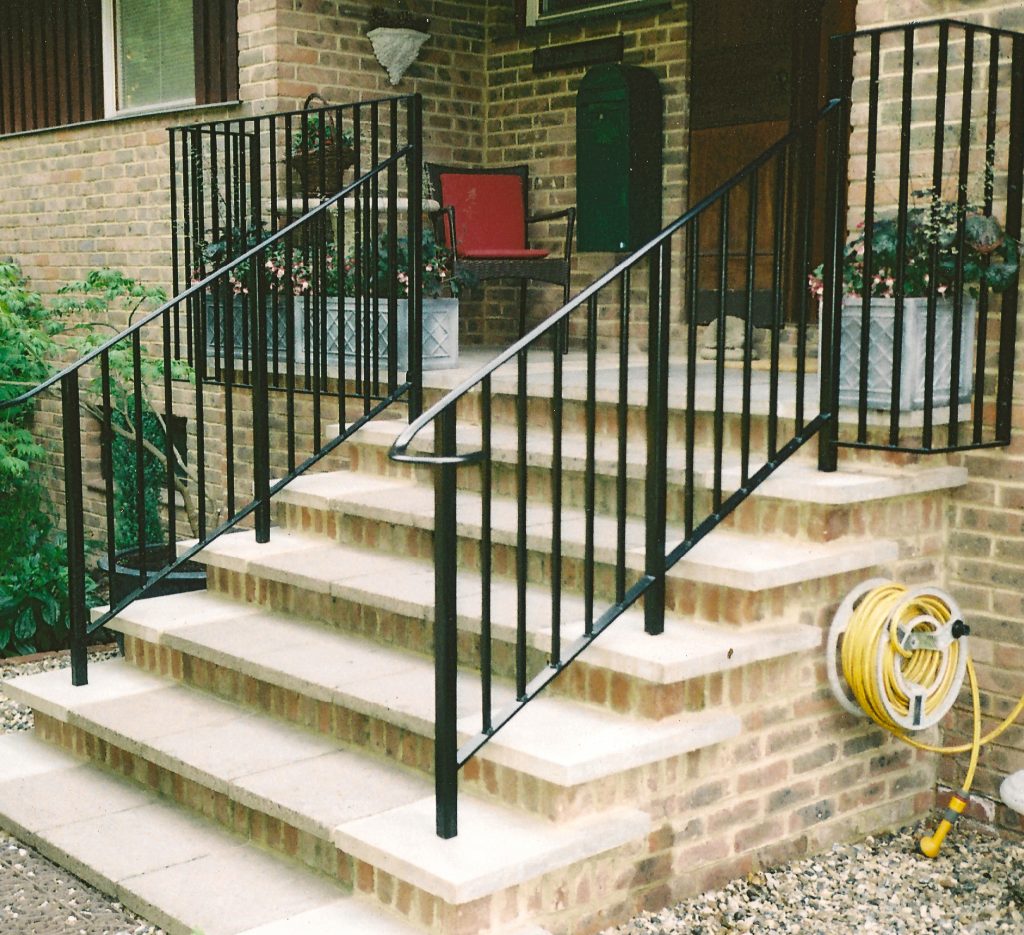 wrought iron hand rail made to fit steps.